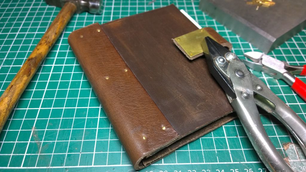 Notebook made from leather offcuts from Ebay. The leather was too thick to sew so I have glued and riveted it instead.